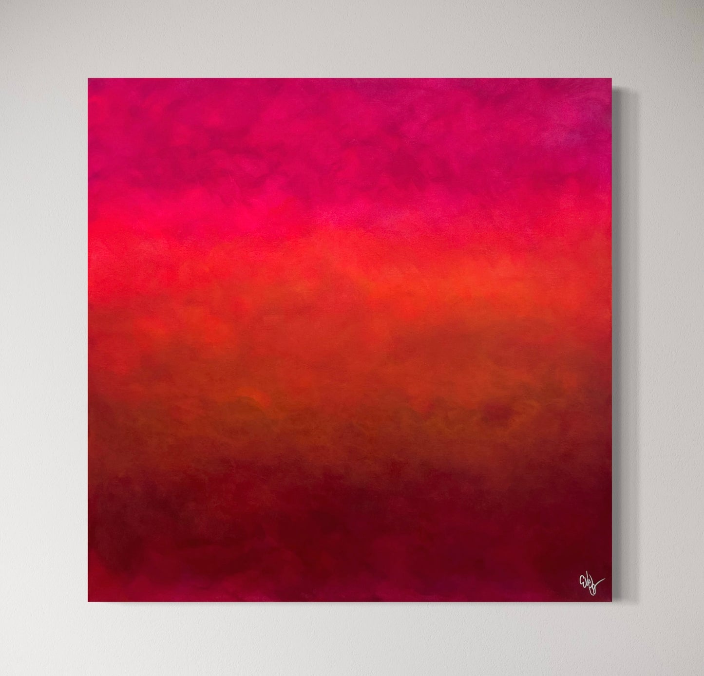 Abstrakt tavla Sunset 80x80 cm med en gradient som skiftar mellan rosa, orange och röd på en vit vägg, konstnär Elin Palmgren